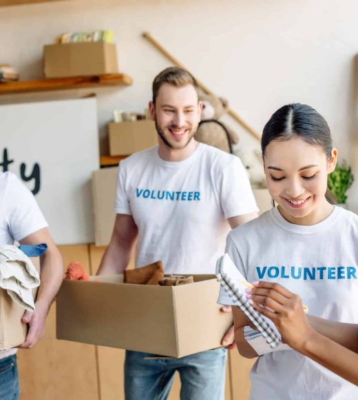 four-young-multicultural-volunteers-in-white-t-shirts-with-volunteer-inscriptions-working-in-charity-1.jpg